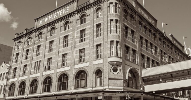 A vibrant street scene featuring various architectural heritage buildings in Fortitude Valley.